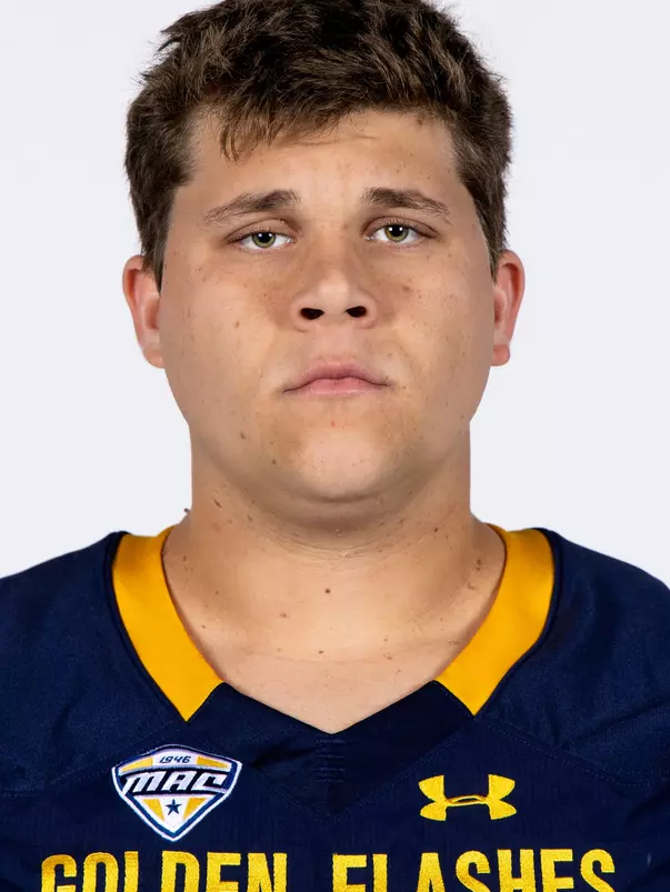 Headshot of a Kent State football player wearing a navy blue jersey with 'Golden Flashes' text in gold letters