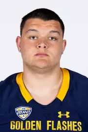 Headshot of a Kent State football player wearing a navy blue jersey with 'Golden Flashes' text in gold letters