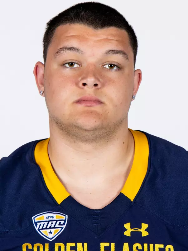 Headshot of a Kent State football player wearing a navy blue jersey with 'Golden Flashes' text in gold letters