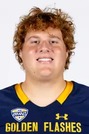 Headshot of a Kent State football player wearing a navy blue jersey with 'Golden Flashes' text in gold letters