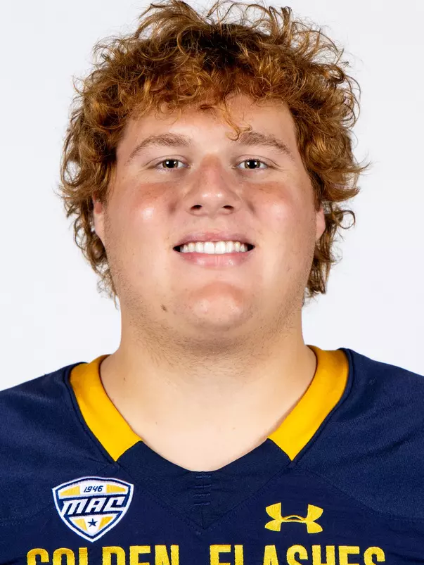 Headshot of a Kent State football player wearing a navy blue jersey with 'Golden Flashes' text in gold letters
