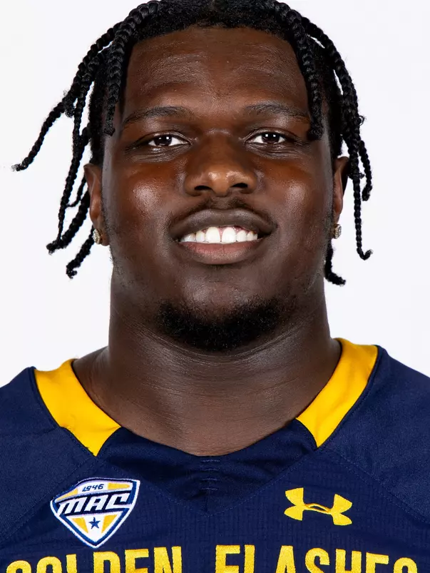 Headshot of a Kent State football player wearing a navy blue jersey with 'Golden Flashes' text in gold letters