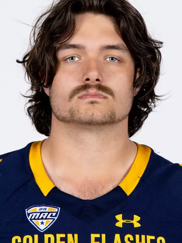 Headshot of a Kent State football player wearing a navy blue jersey with 'Golden Flashes' text in gold letters