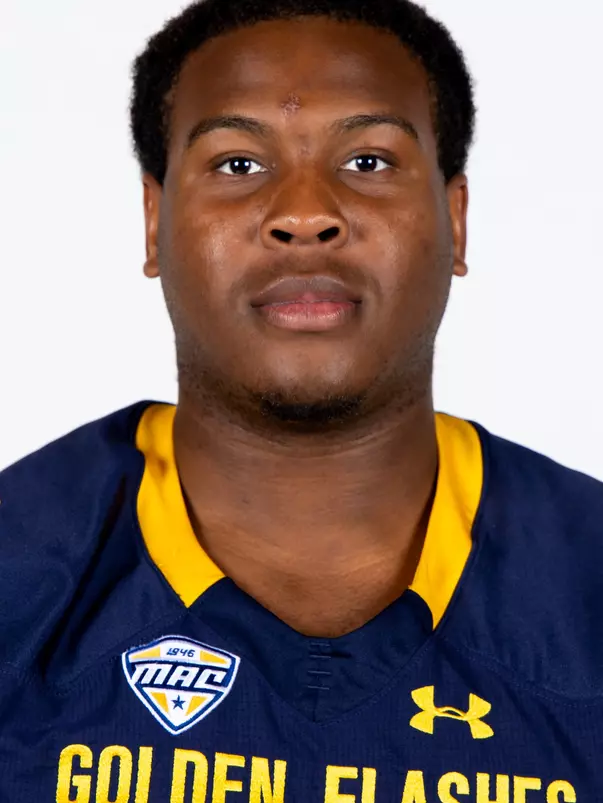 Headshot of a Kent State football player wearing a navy blue jersey with 'Golden Flashes' text in gold letters