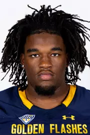 Headshot of a Kent State football player wearing a navy blue jersey with 'Golden Flashes' text in gold letters