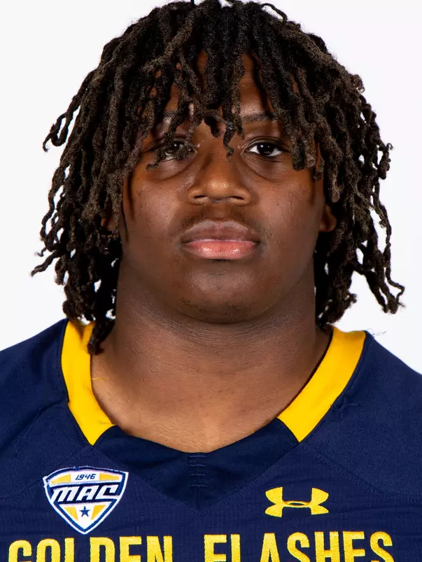 Headshot of a Kent State football player wearing a navy blue jersey with 'Golden Flashes' text in gold letters