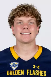 Headshot of a Kent State football player wearing a navy blue jersey with 'Golden Flashes' text in gold letters