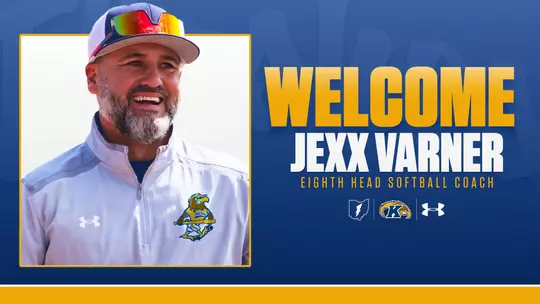 Hire announcement graphic featuring a headshot of Jexx Varner laughing, wearing a gray Kent State Under Armour quarter-zip with the Fearless Flash softball logo and a white cap with colorful sunglasses on the brim, alongside 'Welcome Jexx Varner – Eighth Head Softball Coach' in large gold and white text on a navy background, with the Kent State lightning bolt, Golden Flashes, and Under Armour logos below.
