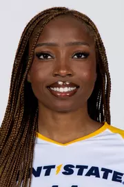 Studio headshot of a smiling young woman with long, braided brown hair, wearing a white Kent State athletic jersey against a plain white background.