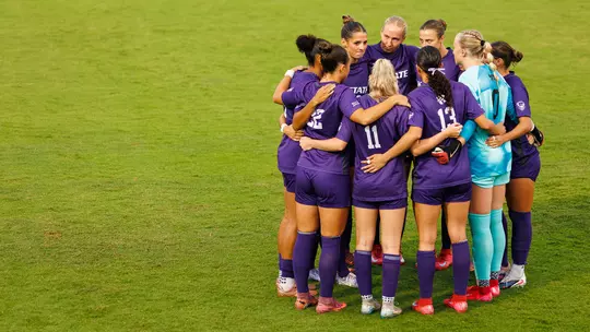 Team huddle vs. Arizona