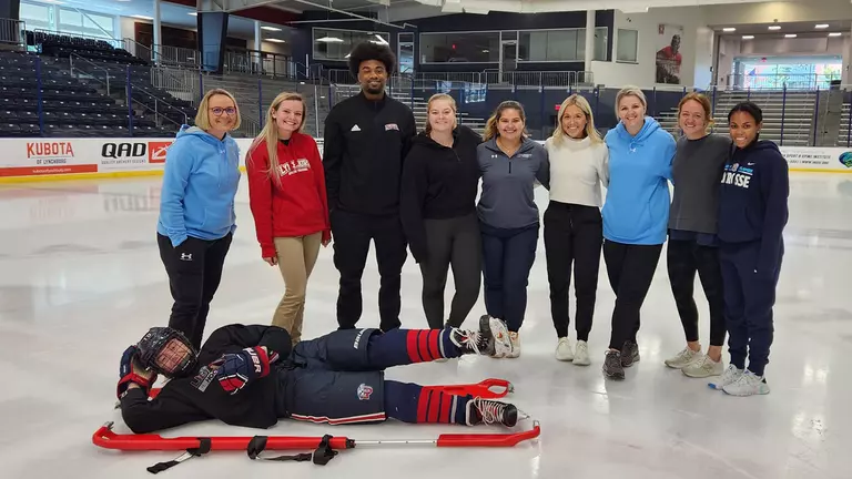 Athletic training students get practical experience treating spinal injuries on ice