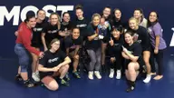Women’s wrestling coach prepped team until well after her due date, plans to return to mat soon