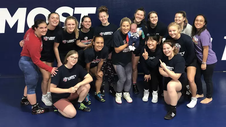 Women’s wrestling coach prepped team until well after her due date, plans to return to mat soon