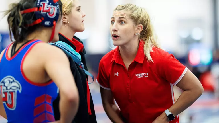 Lady Flames wrestlers growing by leaps and bounds under Manley sisters’ watch