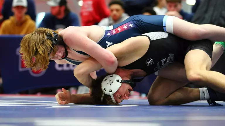 Men’s wrestlers put four in championship finals, five others still alive; three women in fifth-place bouts Saturday