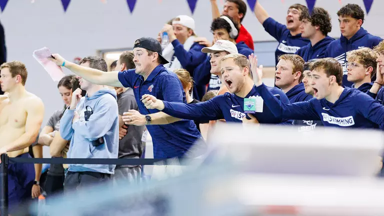 Flames swimmers leave Eastern Region competitors in their wakes at Liberty Natatorium