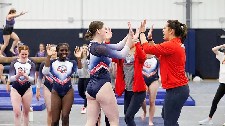 Lady Flames gymnasts prep for nationals by winning Flippin’ Flames Invitational