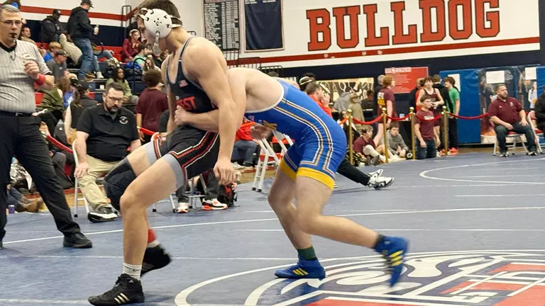 Local wrestling recruit will add depth to Flames’ lineup in upper-middleweights