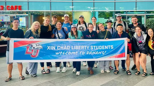 Vietnam team outside college in Da Nang
