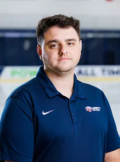 Brett Berthiaume from the Men’s D1 Hockey had his headshot taken in the Lahaye Ice Center on August 27, 2025. (Photo by Simon Barbre)