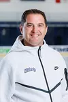 Head Coach Kirk Handy from the Men’s D1 Hockey had his headshot taken in the Lahaye Ice Center on August 27, 2025. (Photo by Simon Barbre)