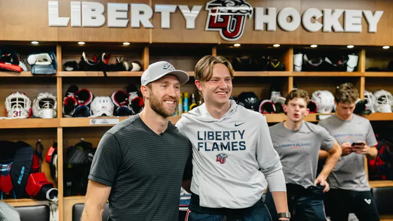 Flames players welcome NHL star Slavin to practice before panel discussion at Convocation