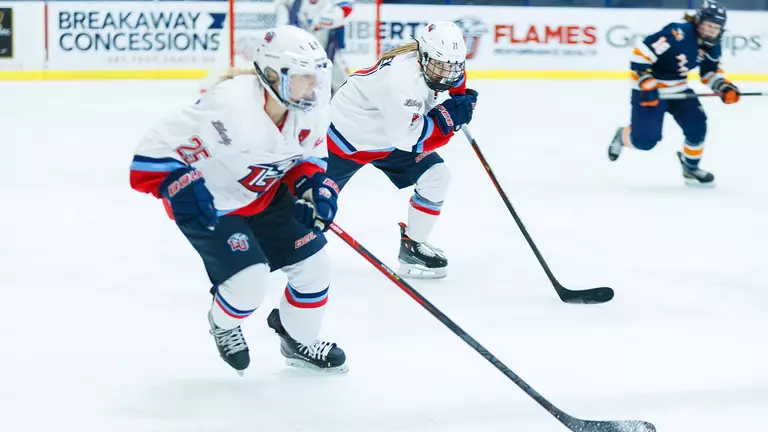 No. 1 Lady Flames fend off No. 2 Warriors in WMCH Showcase, winning 4-3 in OT
