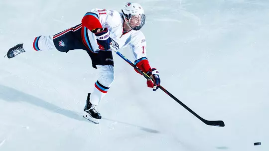 Flames forward Tucker Shields takes shot