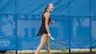 Mariia Dolzhenko with fist clenched after winning a point
