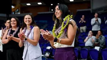 Sarah Baldwin honored with leis prior to first match as head coach.