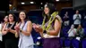 Sarah Baldwin honored with leis prior to first match as head coach.