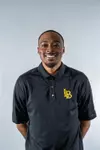 M, Andrews T&F coach