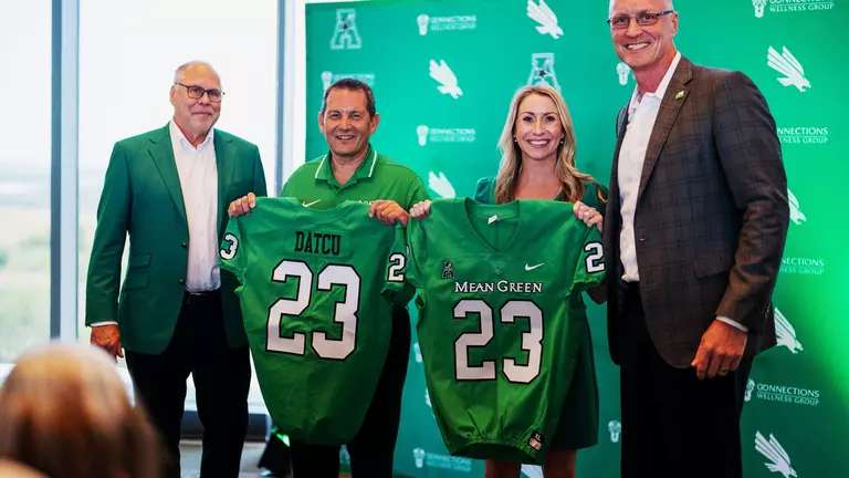 Mean Green Celebrate DATCU Deal