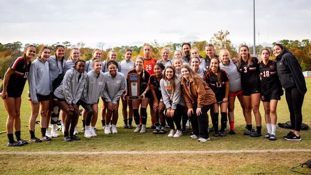 Wsoccer team picture with runner-up trophy