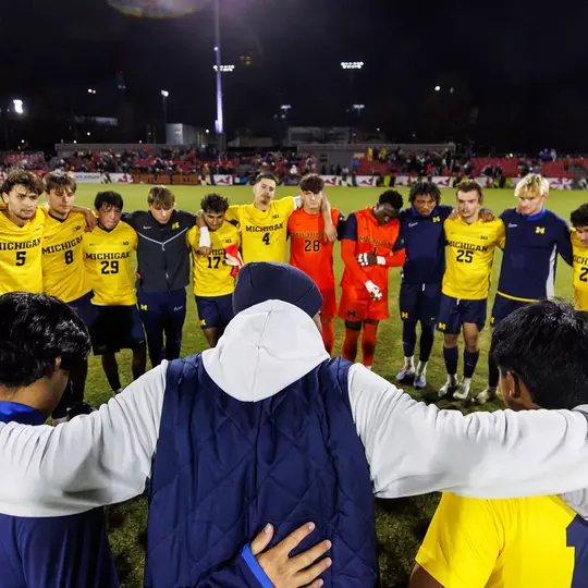 Men's soccer team huddle