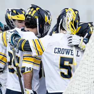 Men's lacrosse team huddle