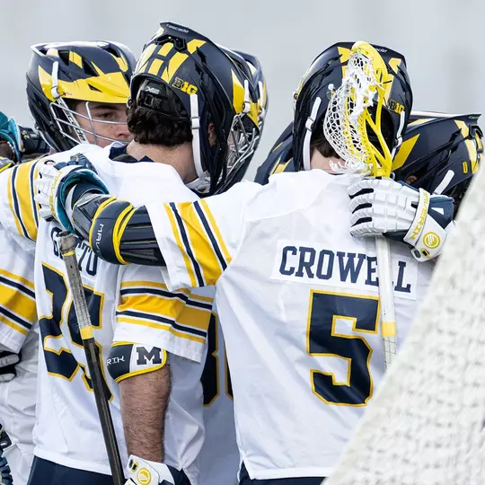 Men's lacrosse team huddle