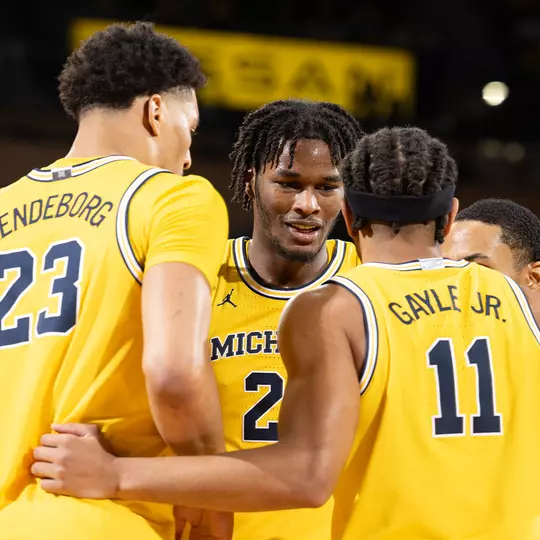Men's Basketball Team Huddle