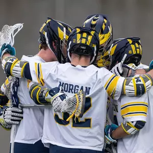 Men's lacrosse team huddle