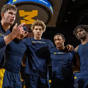 Men's basketball team huddle pregame