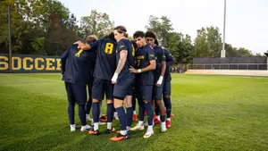 Men's soccer team huddle