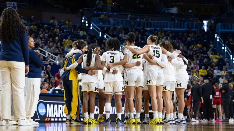 Women's basketball team huddle