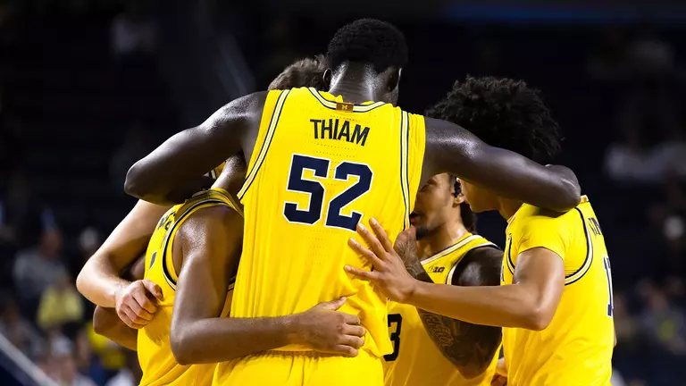 Men's basketball team huddle