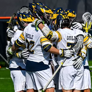 Men's Lacrosse team huddle