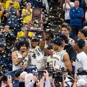 Men's basketball team on-court celebration following Final Four win