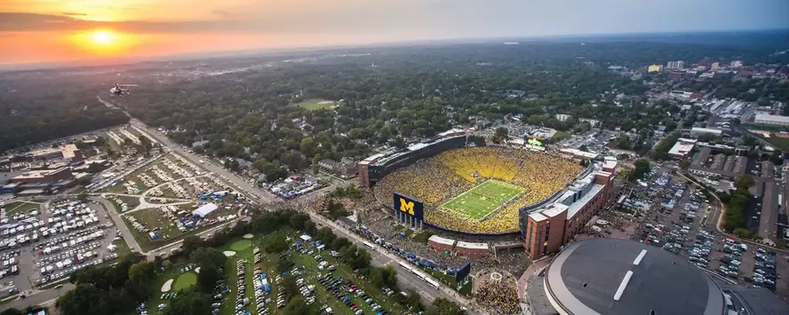 Aerial photo of the Michigan Athletics campus at sunset