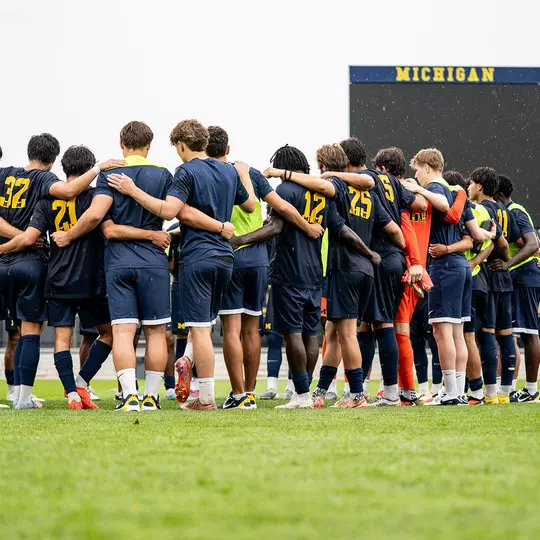 Men's soccer team huddle