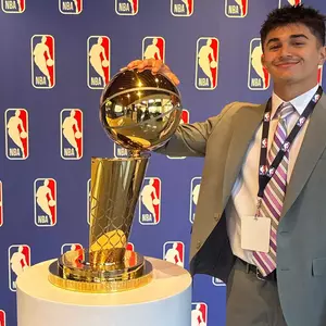 Jake Islam with the Larry O'Brien Trophy