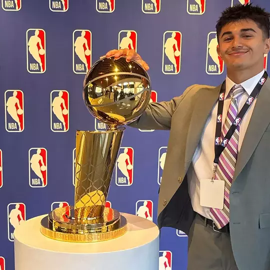 Jake Islam with the Larry O'Brien Trophy