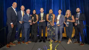 From left: With Donald R. Shepherd Director of Athletics Warde Manuel -- John Beilein, Joe McFarland, Sierra Romero, Chris Sabo, Nikki Peters, Shana Welch, Bev Plocki and Kellen Russell